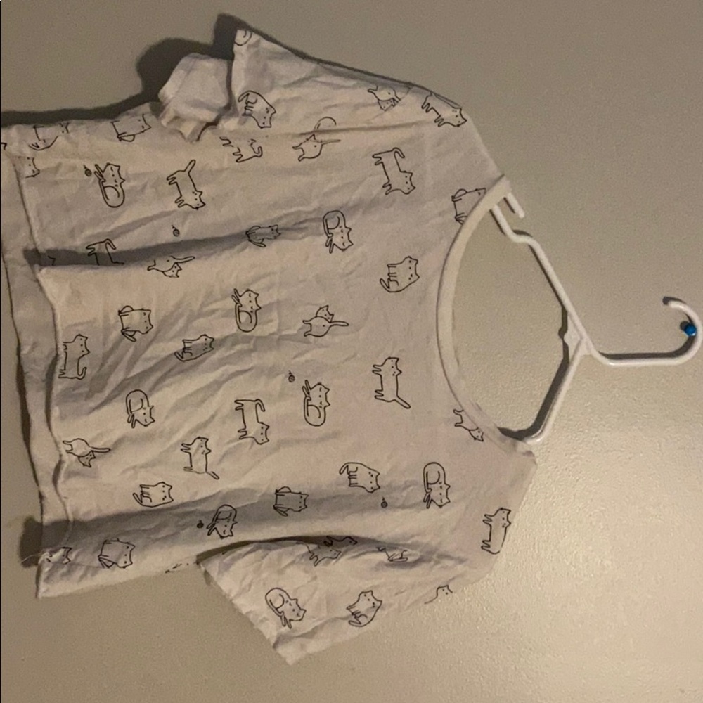 A shirt with cats on it